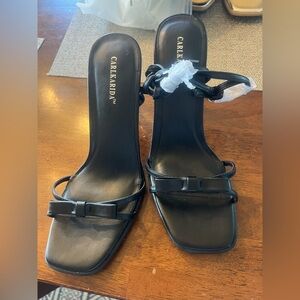 2 1/2 inch heels.‎  Black